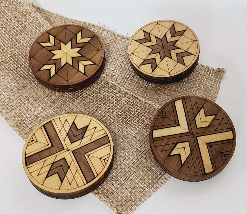 Set of four magnet with a geometric design.  Made from two tone wood.