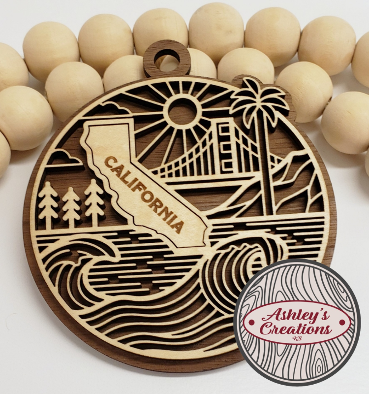 Wooden ornament with California design and 'Ashley's Creations' logo.