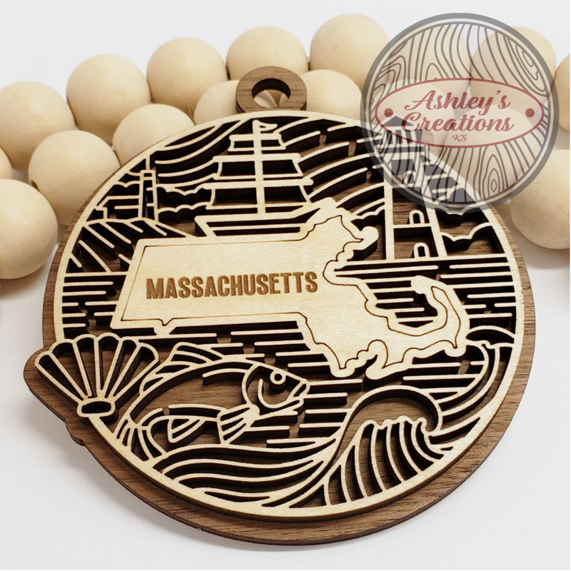 Wooden ornament with the state of Massachusetts in the middle.