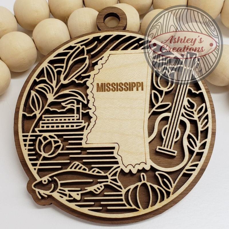 Wooden ornament with the state of Mississippi in the middle.