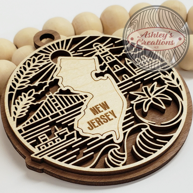 Wooden coaster with New Jersey state design and 'Ashley's Creations' branding.