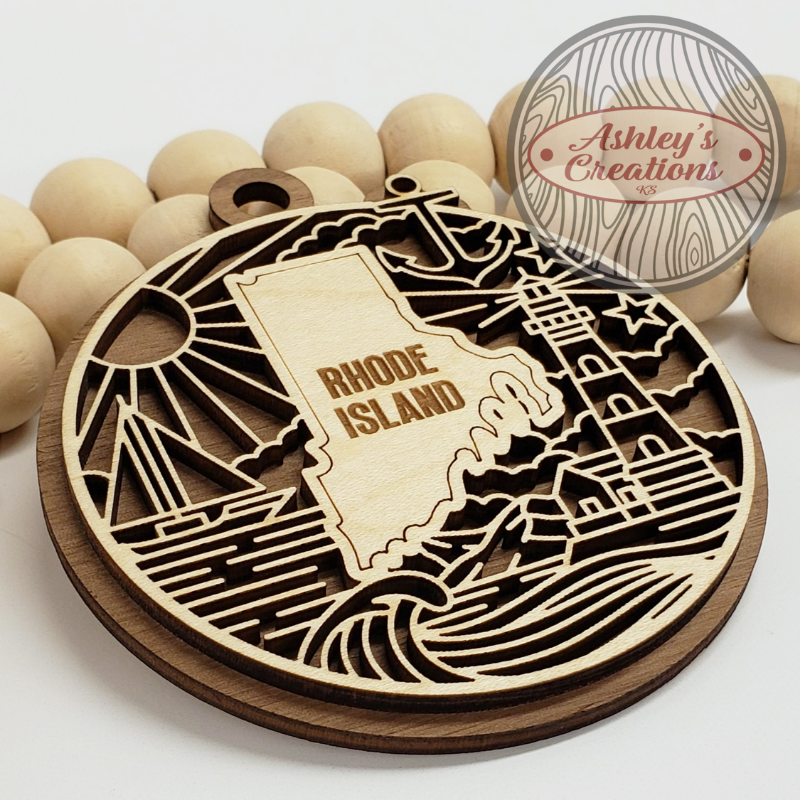 Wooden ornament with 'Rhode Island' design surrounded by wooden beads, branded 'Ashley's Creations'.
