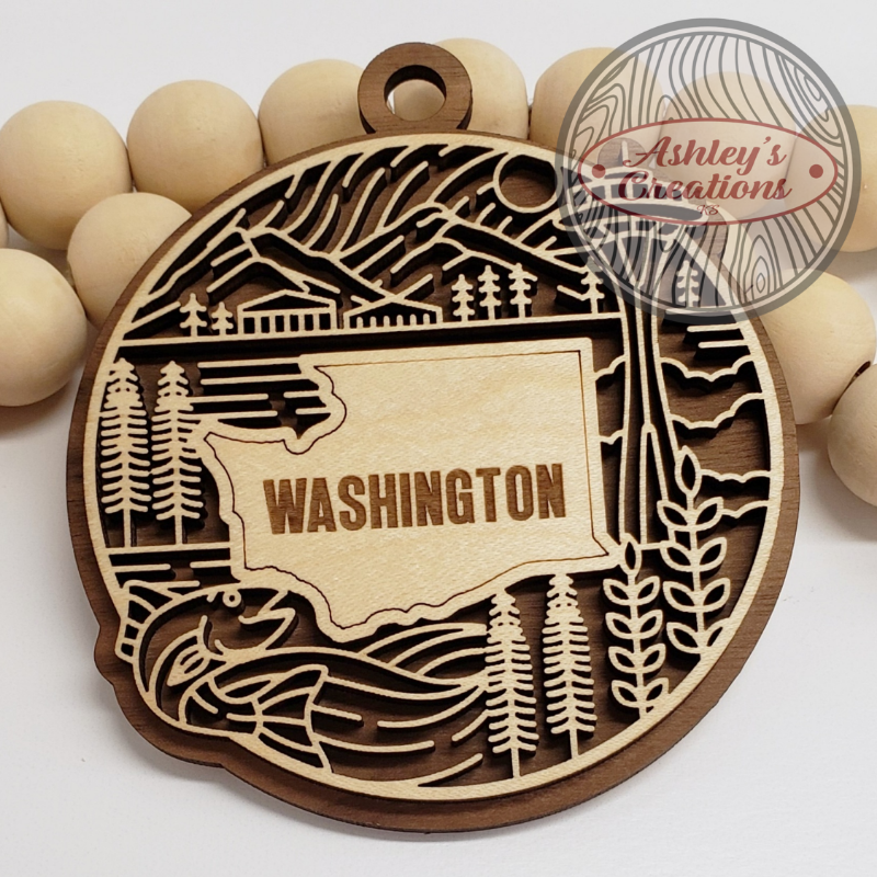 Wooden ornament with 'Washington' engraving on a white background